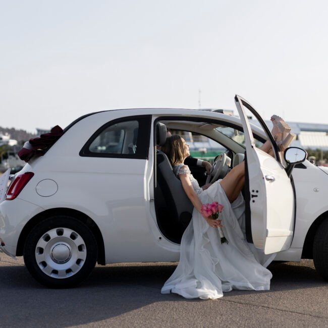 just-married-couple-inside-little-car