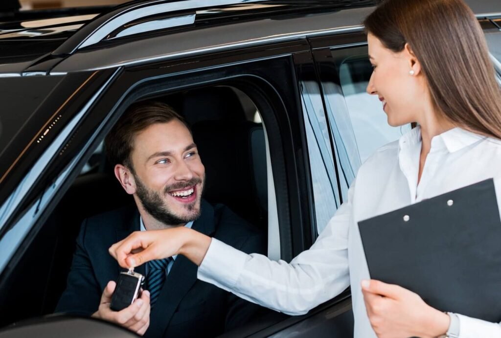 selective focus of beautiful woman giving car key 2024 11 11 06 35 31 utc e1742545349504